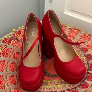 Red Platform Mary Jane shoes.In excellent condition. Never worn. Size 7.5